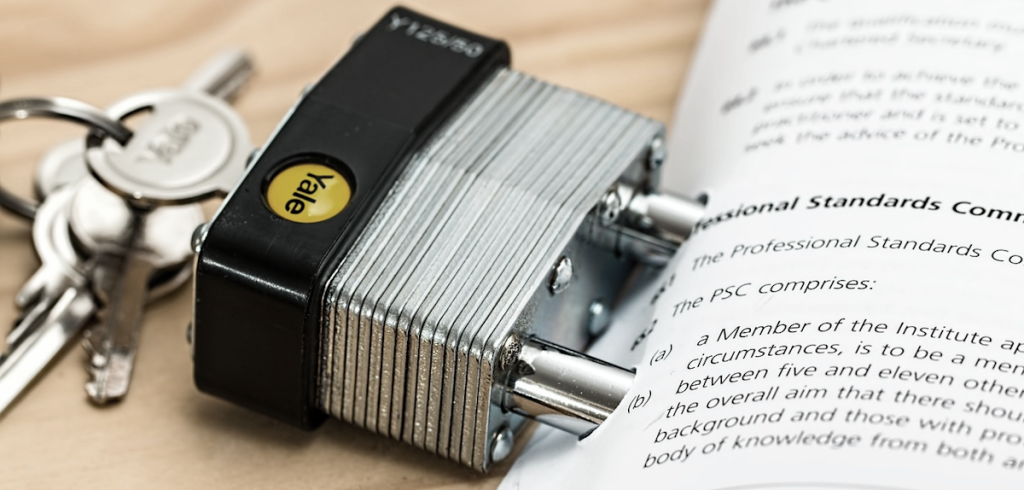 lock with keys locked into paper contract