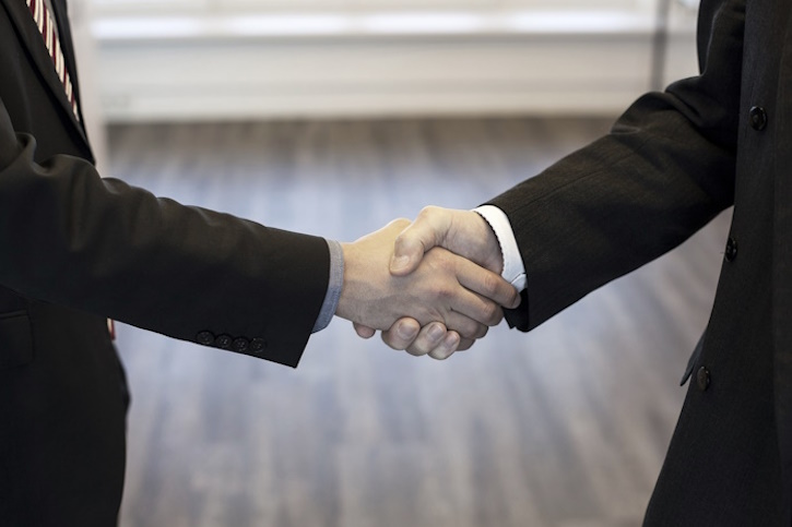 two businessmen shaking hands